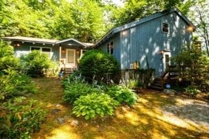 Vacation home exterior and front yard with shrubs