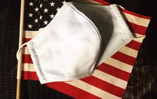 American flag with cloth mask