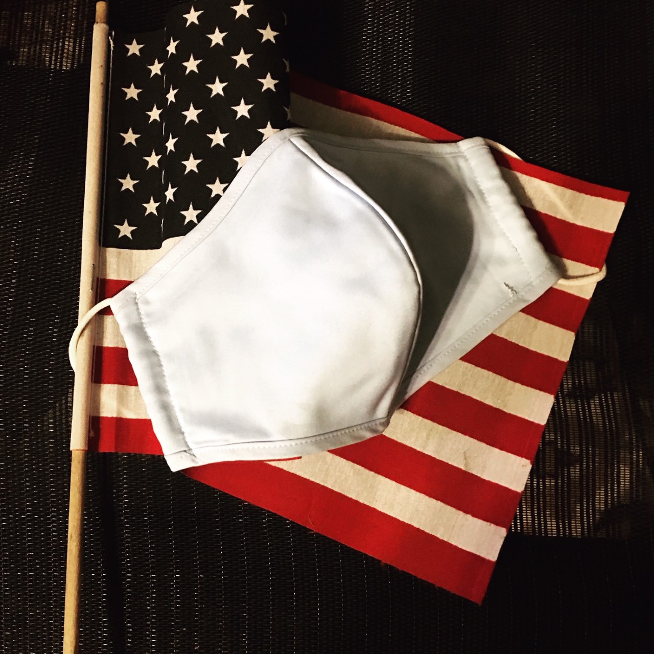American flag with cloth mask